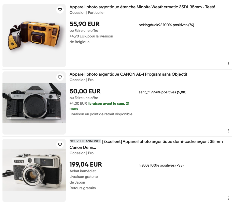 Trois appareils photo argentiques d'occasion, Minolta Weathermatic, Canon AE-1 et Canon demi-cadre
