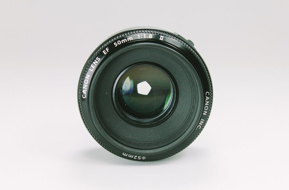 Close-up of a Canon 50mm camera lens, essential photography equipment.